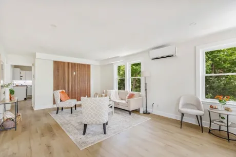 A renovated, light-filled living room after restoration